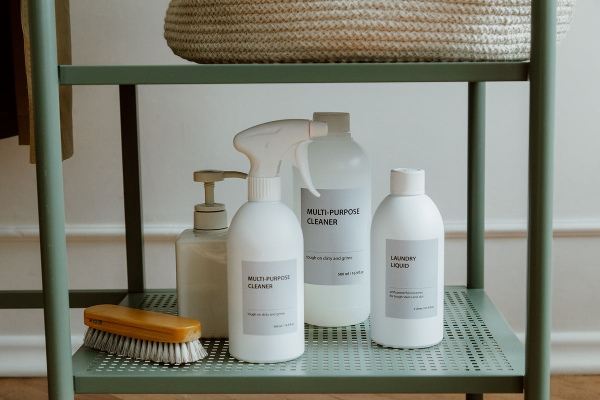 A minimalist display of cleaning products on a shelf, perfect for home organization themes.